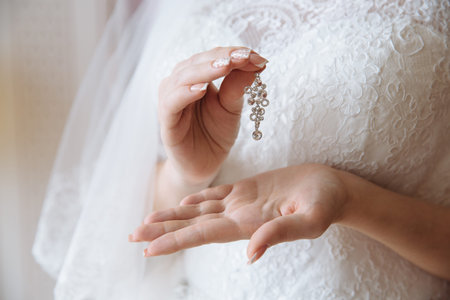 Earrind in the bride's handsの写真素材