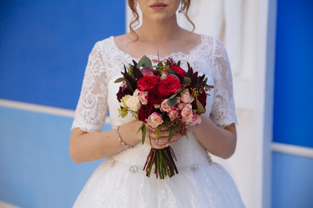 bouquet in the hands of the bride wedding dayの写真素材