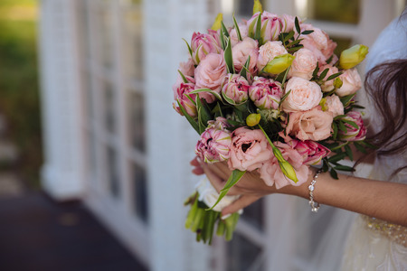 bouquet in the hands of the bride wedding dayの写真素材