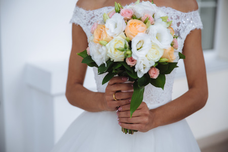 bouquet in the hands of the bride wedding dayの写真素材