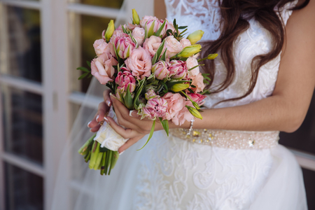 bouquet in the hands of the bride wedding dayの写真素材