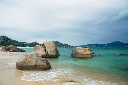 Beautiful landscape with view of ocean, perfect beach, big stones, trees, azure water. Background image. Concept  travelの写真素材