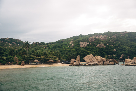 Beautiful landscape with view of ocean, perfect beach, big stones, trees, azure water. Background image. Concept  travelの写真素材