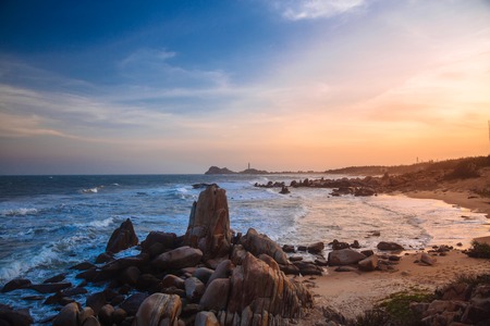 Beautiful landscape with view of ocean, perfect beach, big stones, trees, azure water. Background image.の写真素材