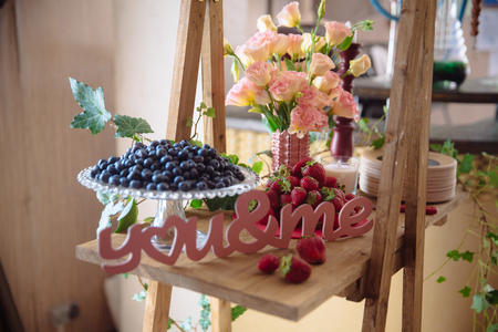 Candy bar. Table with sweets, buffet with cupcakes, candies, dessert.の写真素材