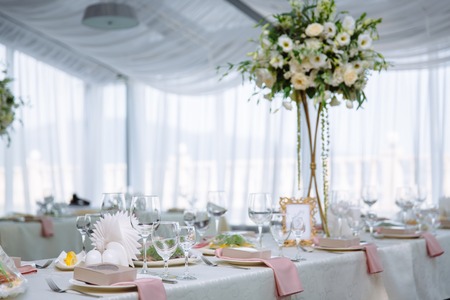 Beautiful decorated wedding restaurant for marriage. Colorful decoration for celebration. Beauty bridal interior. Concept of style of banquet hallの写真素材
