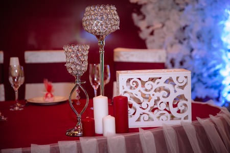 Wedding decorated table with candles and champagne in the tenderly light blue styleの写真素材