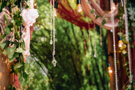 Part of Wedding ceremony arch, altar decorated with flowers on the lawnの写真素材