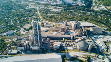 Aerial view of cement manufacturing plant. Concept of buildings at the factory, steel pipes, giants.の写真素材