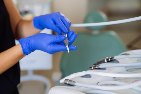 Close-up medical equipment of a dentist in the hands of a doctor. dental clinic, concept of healthy.の写真素材