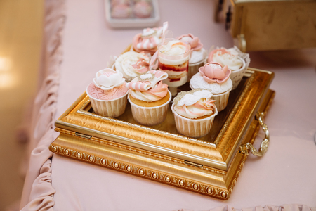 Candy bar. Table with sweets, buffet with cupcakes, candies, dessertの写真素材