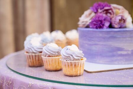 Candy bar. Table with sweets, buffet with cupcakes, candies, dessertの写真素材