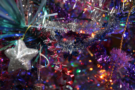 Christmas tree decorated with garlands and stars - white, blue and red. Creates a real festive...