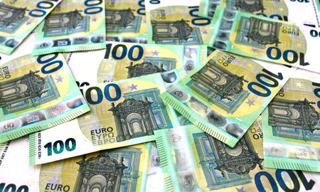 Background of 100 euro banknotes beautifully laid out. Euro money. Close up view.