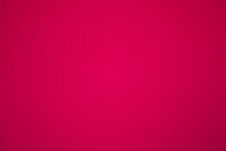 Burgundy background, with a texture of facade plasterの写真素材