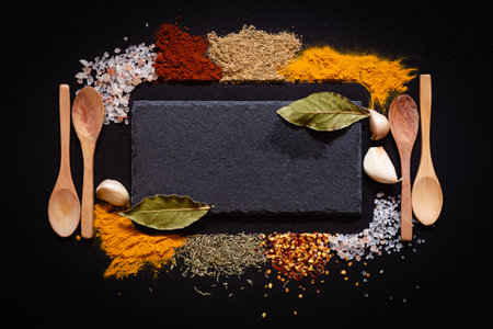 Set of Various spices on black stone table. Top view with copy space.の写真素材