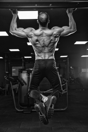 Brutal strong athletic men pumping up muscles workout bodybuilding concept background