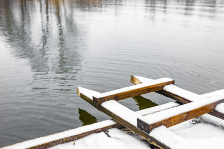 Background water surface. Small river in winter, reflection. Natural texture and natural color.の写真素材