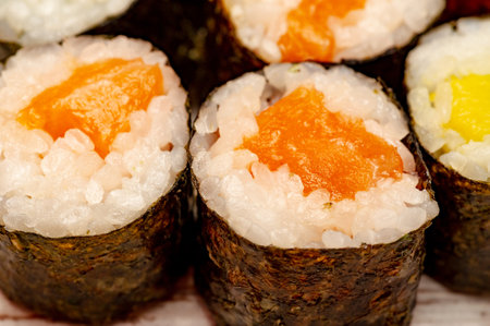 Salmon roll. Rolls with salmon, cucumber and avocado.の写真素材