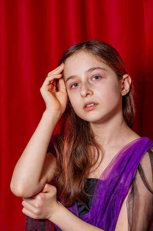 Portrait of a teenage girl in purple with a black dress.の写真素材