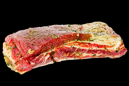Beef meat marinated on black background. Raw beef ribs marinated isolate.の写真素材