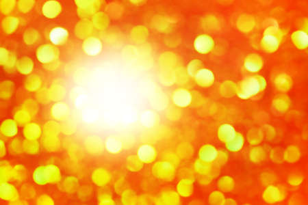 Abstract bokeh light background. Defocus light orange and green glitter.の写真素材