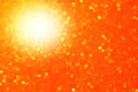 Abstract bokeh light background. Defocus light orange and yellow glitter.の写真素材