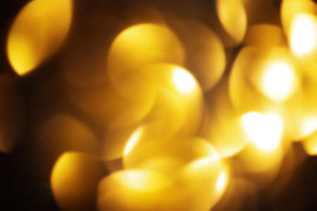 Luxury and gold concept. Defocus light sparkles of gold color as a background for designers.の写真素材