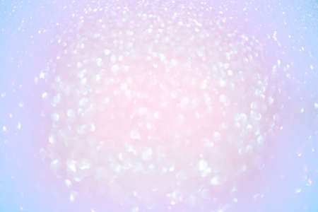Abstract bokeh light background. Defocus light pink and purple glitter.の写真素材