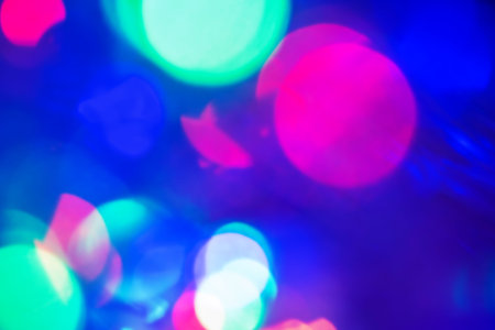 Defocused light dots abstract background. Garland defocus light glare.
