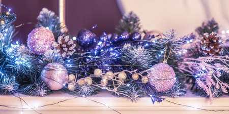 Christmas ornament. Christmas tree in toys and garlands. Decorating a branch of a Christmas tree for the new year.の写真素材