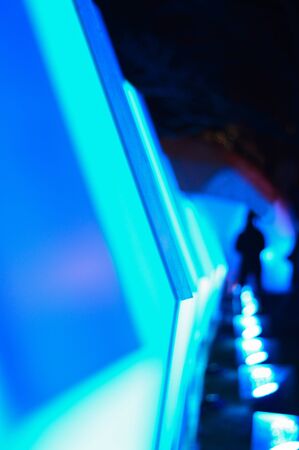 cosmic neon blue light,abstract background from geometric light installation with human figure for creative designの写真素材