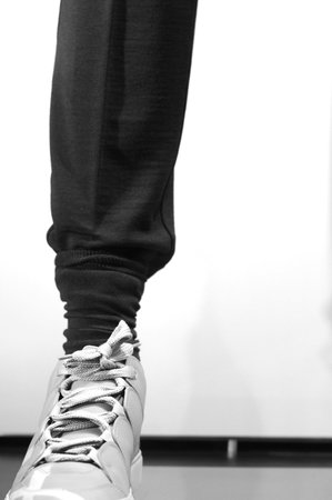 man's legs with sneakers, fashion concept image
