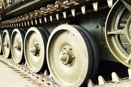 front view of the tracks and wheels of the tank to demonstrate the power and strength of military equipmentの写真素材