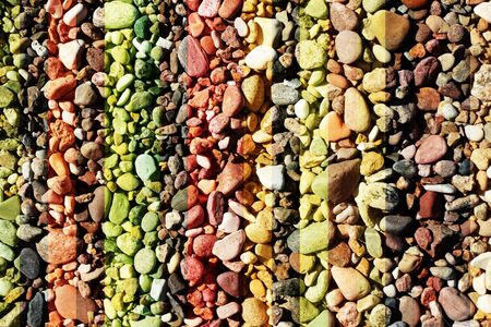 pebble and seaside stones in the sunny bright day on the beach, tinted for design and backgroundの写真素材