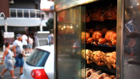 grilled chicken shop, barbecue showcase on the street marketの写真素材