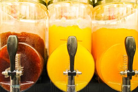 juice slush freezer machine with colorful frozen drinks, make all kinds of cold beverages to enjoy during a hot dayの写真素材