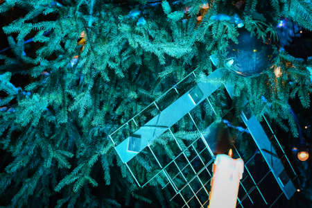 christmas tree with festive lighting and decorations on advent eveの写真素材