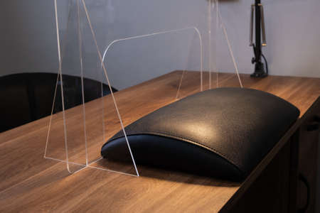Manicure table with protective shield for social distancing during coronavirus pandemic.の写真素材