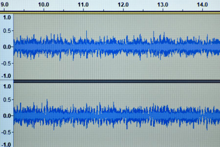 Digital audio stereo tracks on computer music software. Monitor screen with music app and audio...