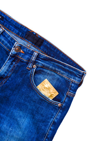 Jeans with condom packaging in pocket. Mens blue jeans with condom packaging in front side pocket on a white background.の写真素材