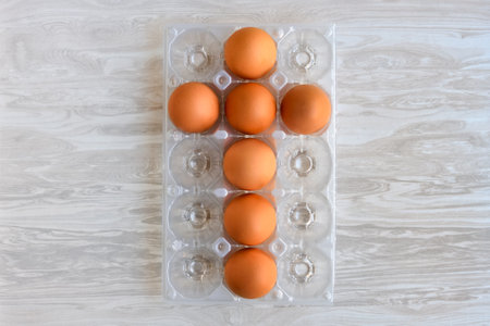Chicken eggs laid out in the shape of a cross for the Easter holiday.の写真素材