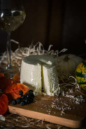 different slicing cheeses Handmade cheese on a wooden board delicious treats foodfotos foodphotoの写真素材