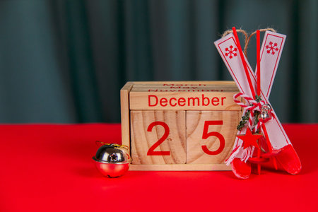Photo of a wooden calendar on a red background, christmas, wooden toys