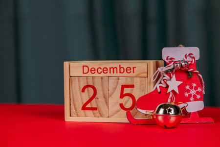 Photo of a wooden calendar on a red background, christmas, wooden toys, place for text
