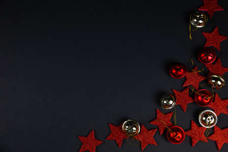 Christmas background concept. red stars on black background, christmas decor, flatlay.の写真素材