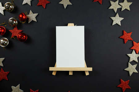 Christmas background concept. red stars on black background, christmas decor, flatlay.の写真素材