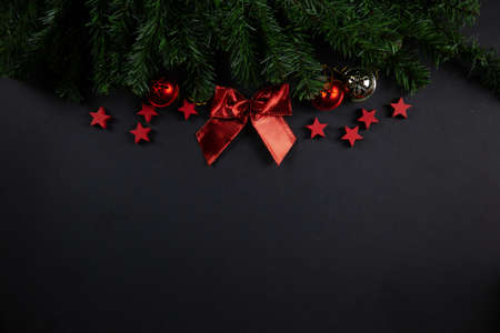Christmas background concept. red stars on black background, christmas decor, flatlay.の写真素材