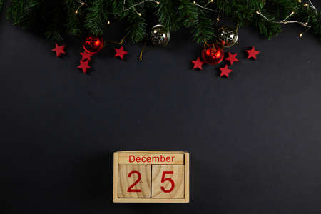 Christmas background concept. red stars on black background, christmas decor, flatlay.の写真素材
