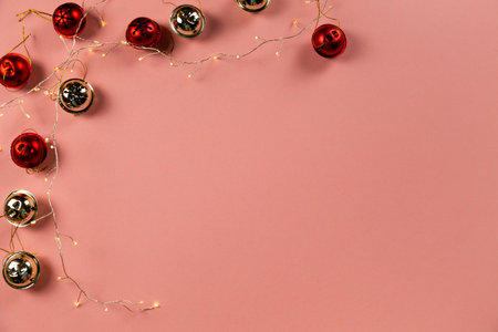 Top view of Christmas bells with many candy cane on pastel pink background.Holiday festive celebration greeting card with copy space to addng textの写真素材